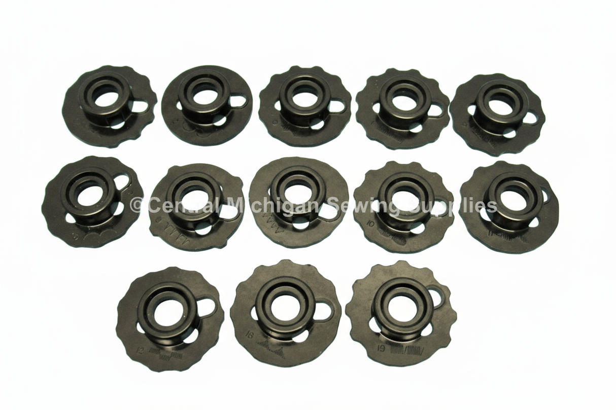 Sewing machine bobbins with white background