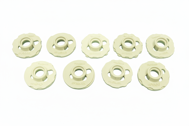 White sewing machine bobbins with white background